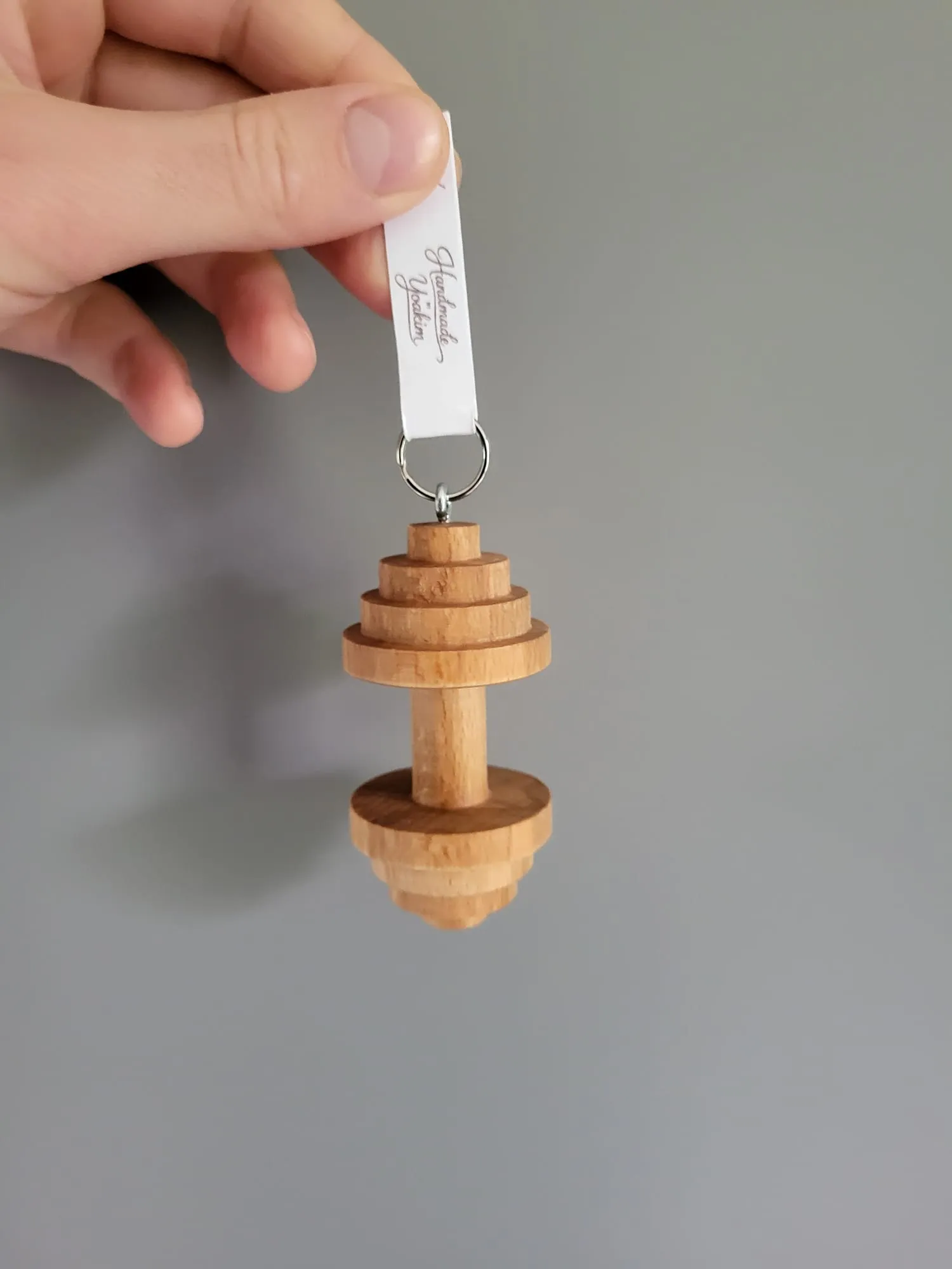 Dumbbell held in the hand