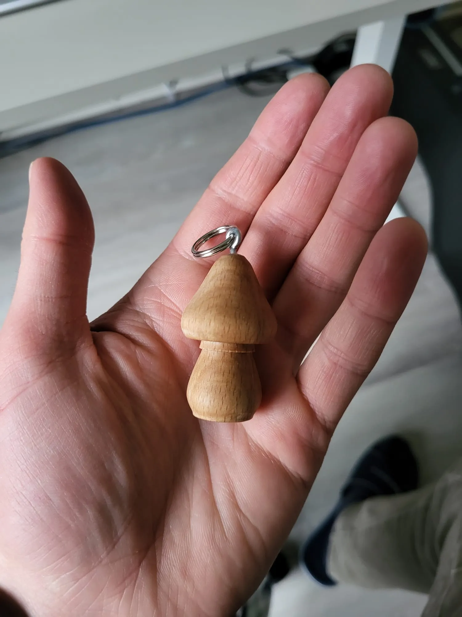 Mushroom keychain in the hand